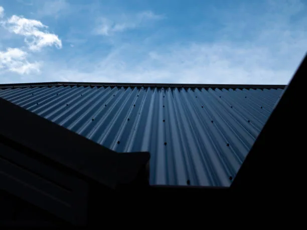 Corrugated roof sheeting against the sky