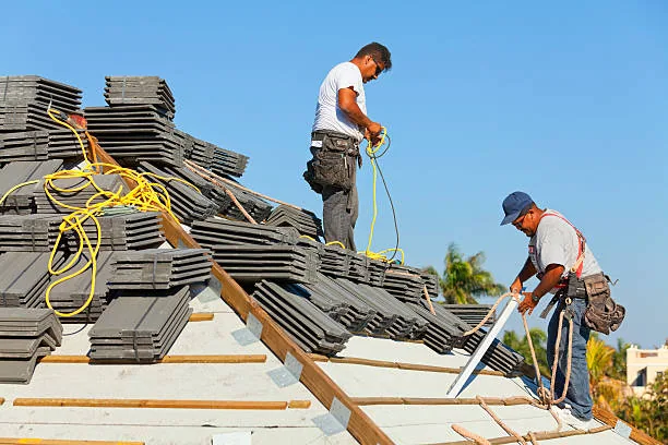 Professional roofing crew installing a new roof